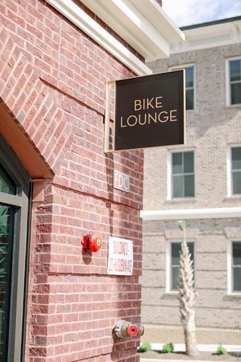 Entry to the bike lounge in a red brick building